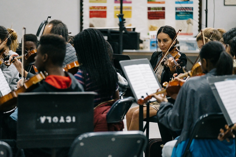 Vianney Bernabé, is a member of the Inner City Youth Orchestra of Los Angeles and assists other students during rehearsals. (Photo: Terence Patrick)