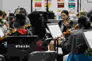 Vianney Bernabé, is a member of the Inner City Youth Orchestra of Los Angeles and assists other students during rehearsals. (Photo: Terence Patrick)