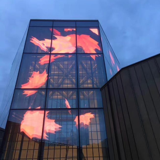 Digital signage technology displaying orange maple leaves.