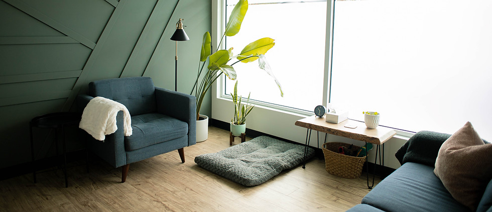 Therapy room of Nataliya Myssechko RSW with armchair and sofa