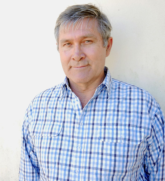 Stephen Howard, counsellor and psychotherapist, wearing a blue checked business shirt.