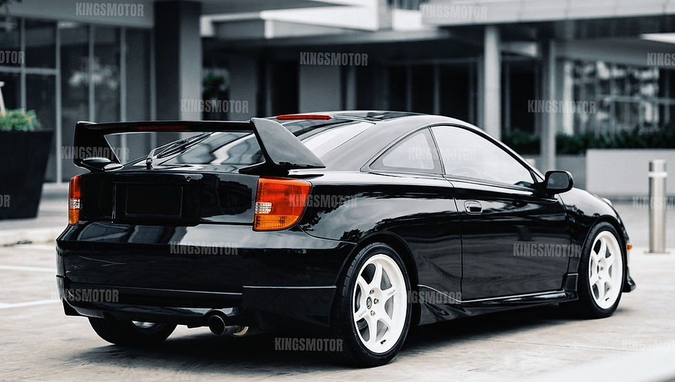 Thumbnail: Angled side-rear view of gloss black TRD wing spoiler fitted on Toyota Celica 2000–2005, showing clean fitment