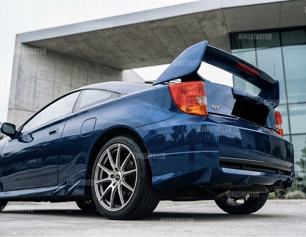 Thumbnail: Custom color - Spectra Blue Mica (8M6) 2K painted TRD-style rear spoiler side profile on Toyota Celica 2000–2005.
