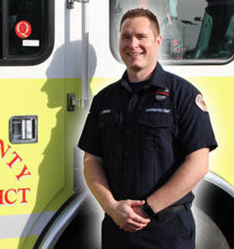 Firefighter Isaac Merkl in Front of Engine 1311