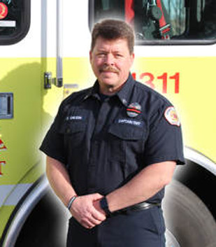 Firefighter Carl Chilson in front of Engine 1311