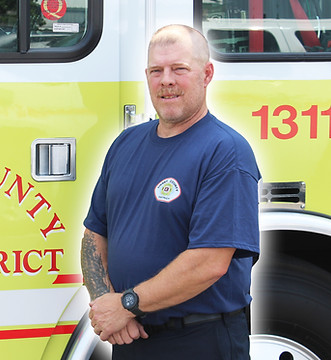 Firefighter Steve Pittack in front of Engine 1311