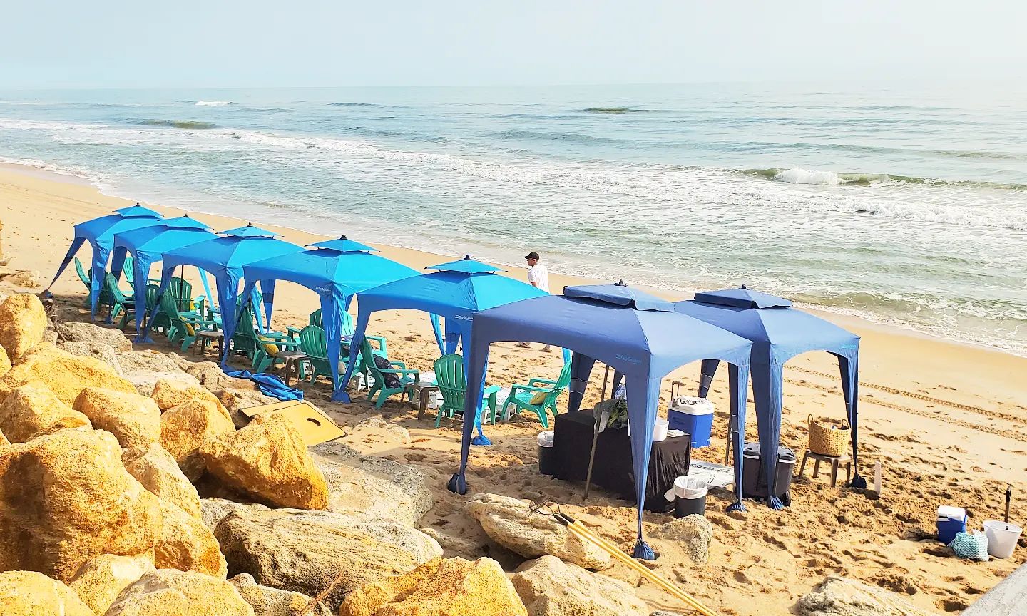 Blue cabanas on New Smyrna Beach ready for a small wedding or elopement