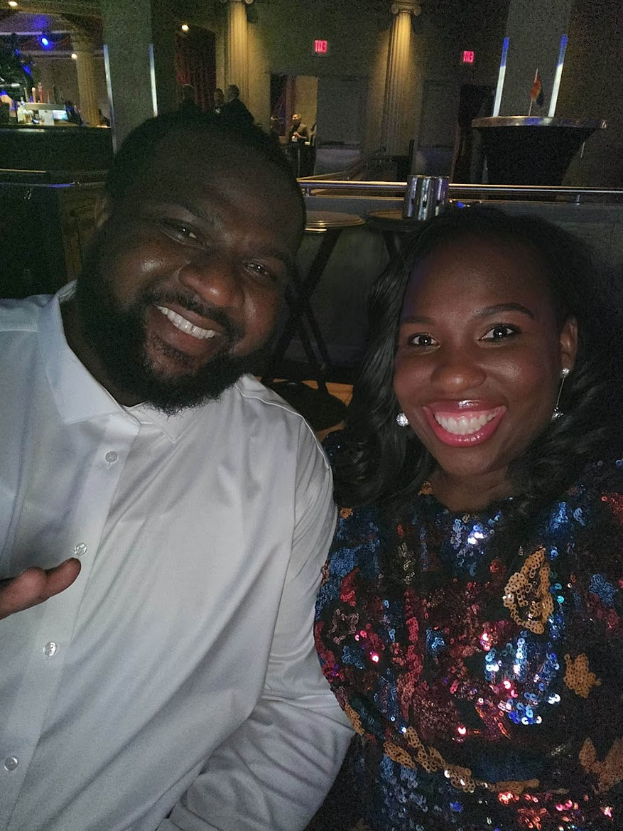 Smiling man and woman at event