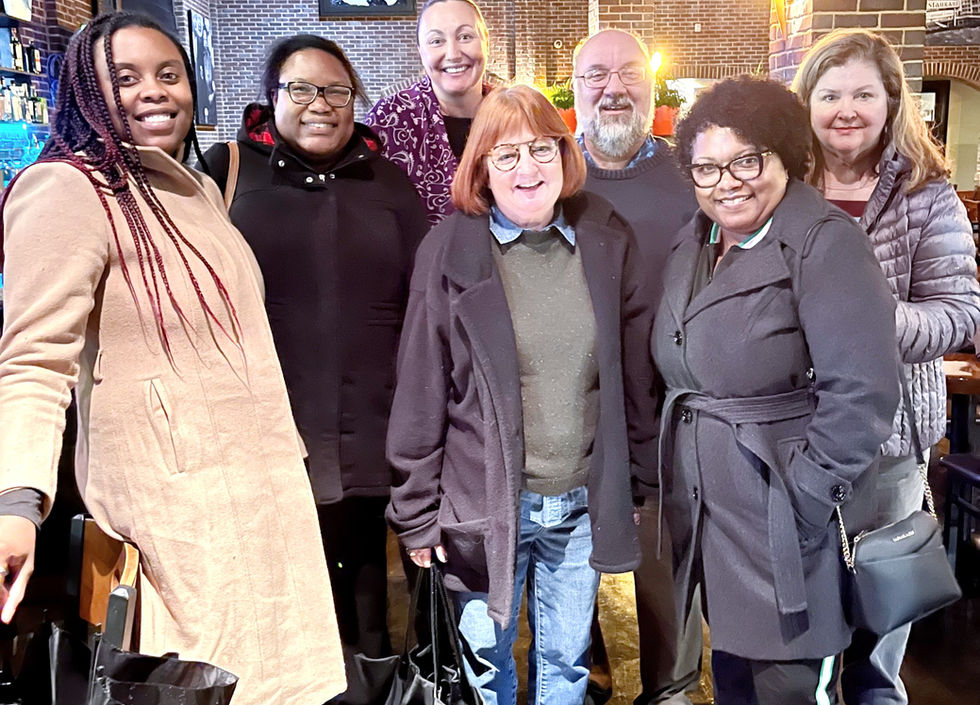 Diverse group of PLANC Members at PLANC Conference smile at camera.