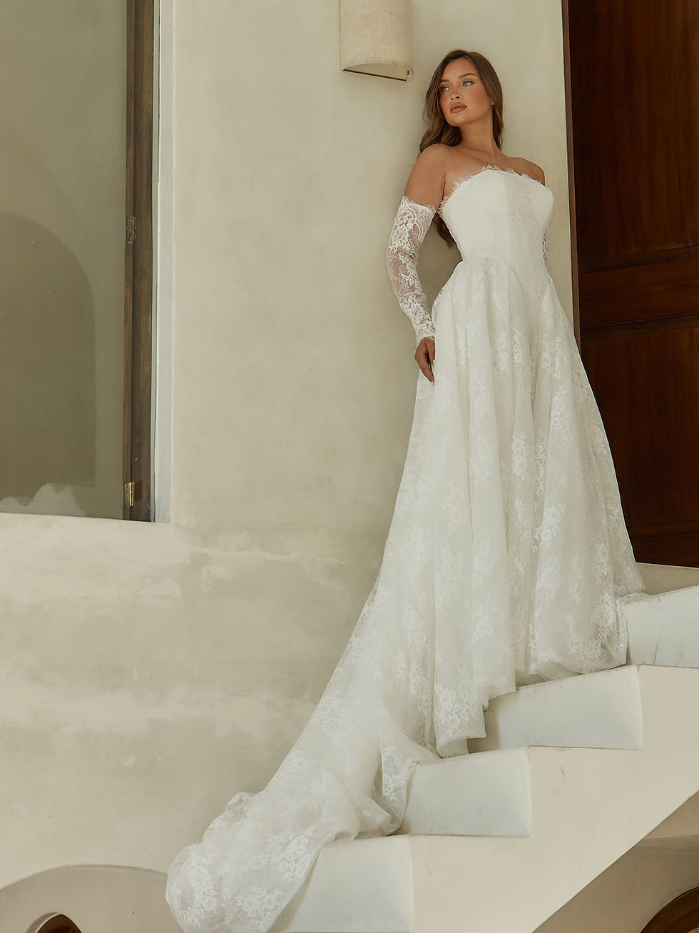 Thumbnail: Garner by Serene Madi Lane wedding gown showcasing elegant lace skirt and dramatic bridal train