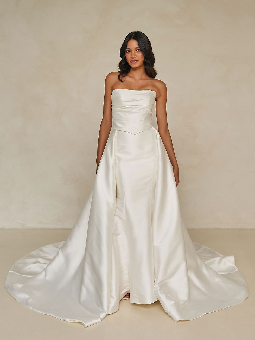 Thumbnail: Front view of Wagner Overskirt satin bridal gown featuring strapless neckline, structured silhouette, and dramatic train