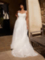 Nyrie by Madi Lane bridal gown, featuring floral lace straps, a fitted bodice, and flowing A-line skirt with soft tulle layer