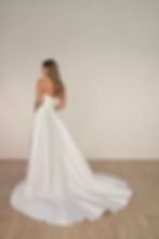 strapless Stella York SY8191 Elaina wedding dress, highlighting delicate mikado fabric and chapel train silhouette