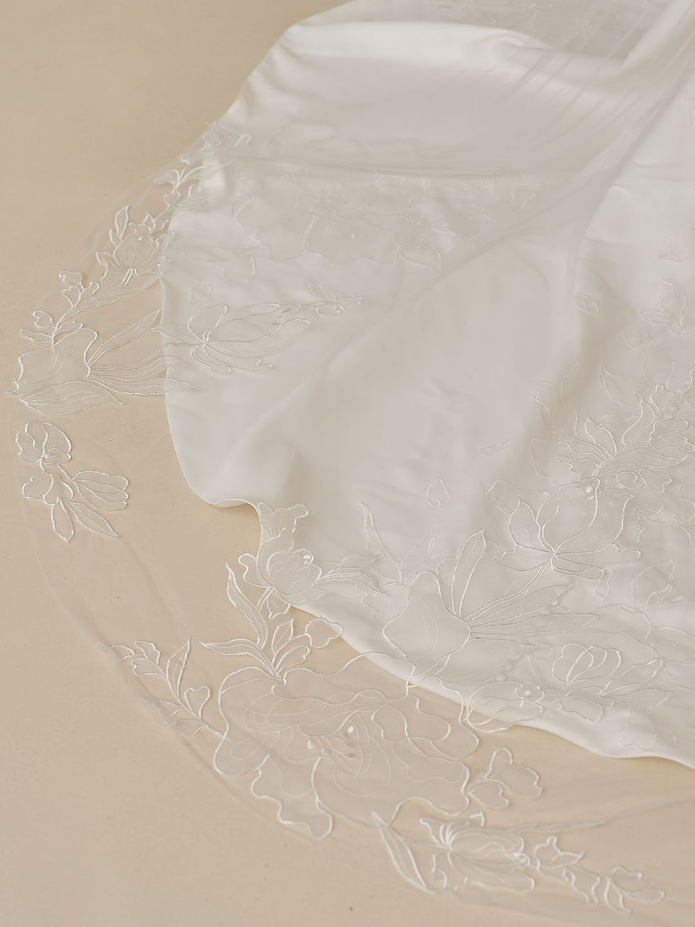 Thumbnail: Back view of Wendall by Madi Lane wedding dress showcasing floral embroidered train and veil