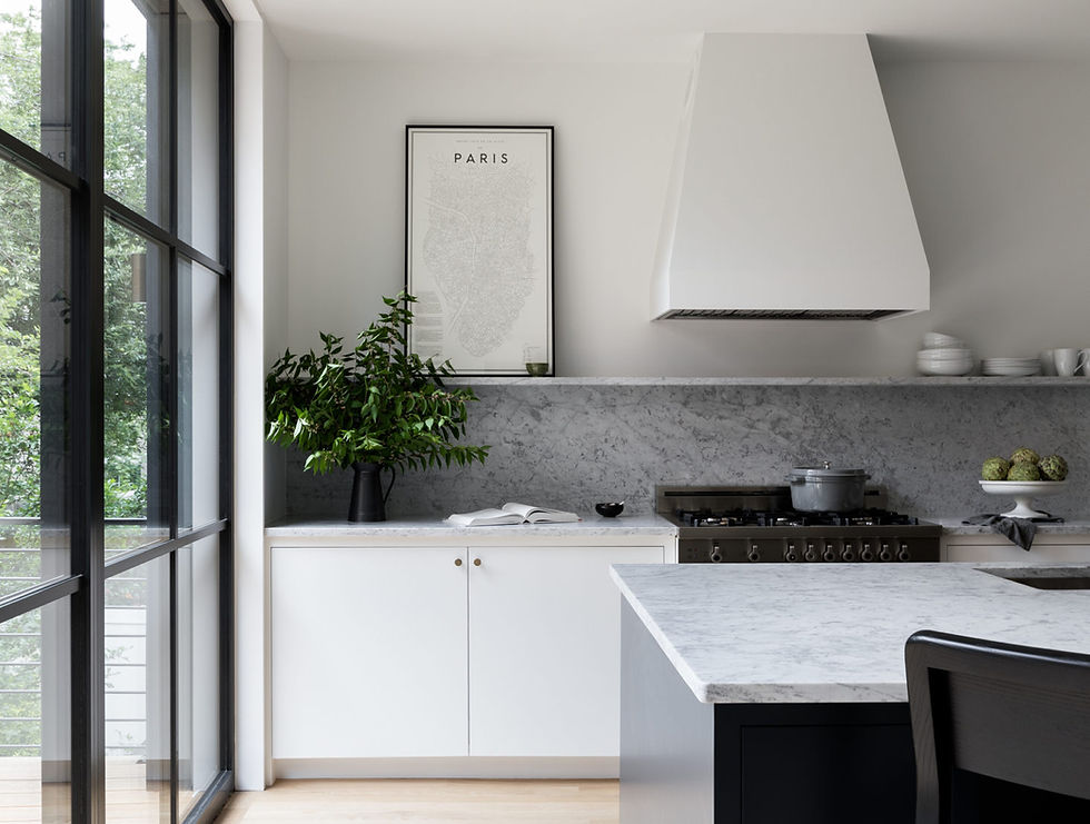 The kitchen range is Bertazzoni and the hood is Faber.