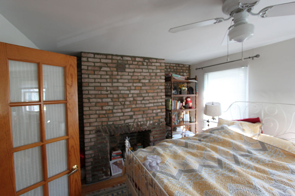 The low ceilings in the original master bedroom made the space feel small and closed off. The architects were lucky enough to uncover original beams in the remodel and left them exposed for an airier feel.