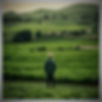 a photo of man with great nature landscape full of green farm _edited.jpg