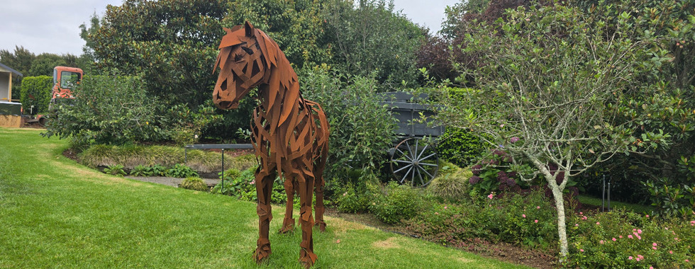 horse sculpture made from strips of rusting metal