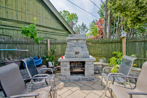 An outdoor stone fireplace.