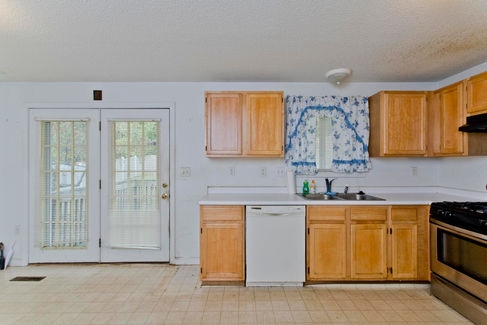 Off of the kitchen of this two story Chicopee home is a a large dining area with French doors that lead to the back porch. Ample natural light. 