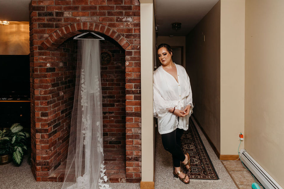 Mallarie looks at her 11 foot veil.