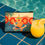 Thumbnail: Ibiza accessory pouch on ceramic tiles at poolside.