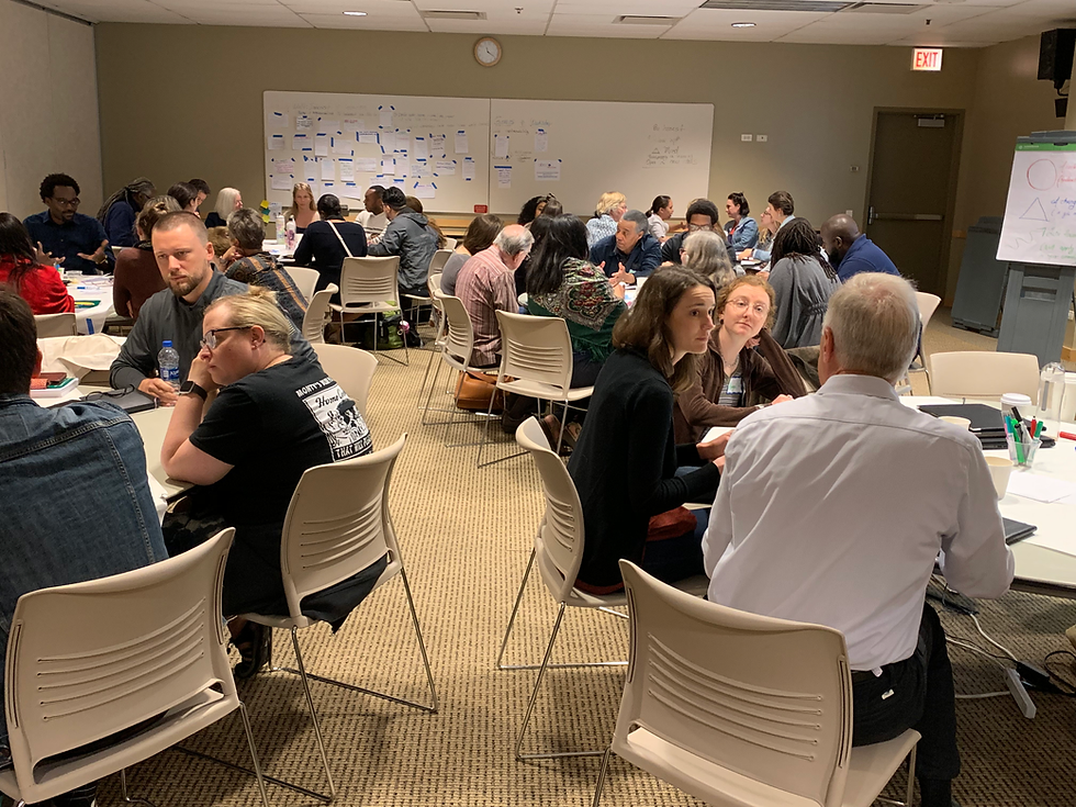 Diverse group in a workshop by aging and intergenerational consulting firms.