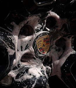 Deep-cleaned Porsche rim foamed and restored. 