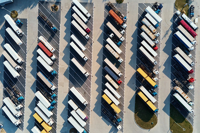 Top_View_Parking_Lot_With_Parked_Trucks_original_1068215.jpg