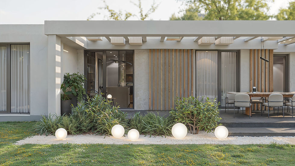Modern house exterior with a patio, wooden accents, and glass doors. Spherical lights on a landscaped garden create a serene atmosphere. Rendering done by Renderistic