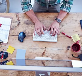 Man Working at a Desk.webp