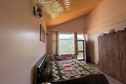 Spacious hotel room with stunning mountain view from SUNS Cottage Kasauli