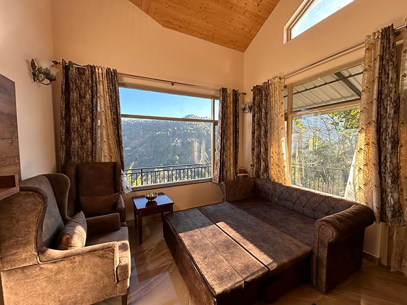 Living Area with mountain view at SUNS Cottage Kasauli