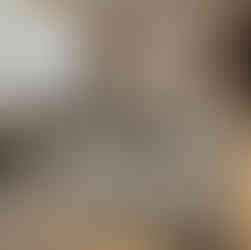 A contemporary living room featuring a bespoke carpet with an intricate artistic design, acting as a conversation piece with modern furniture and natural light.