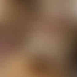  Cozy Bohemian reading nook with a textured jute rug, vibrant cushions, and patterned throws.