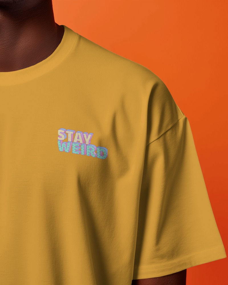 Mustard yellow unisex oversize T-shirt with front chest print "stay weird"