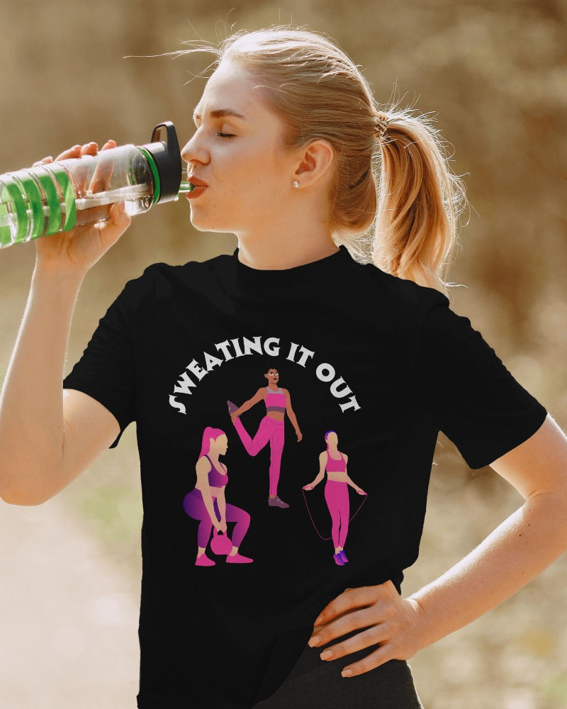 Morbido round neck black women's T-shirt with design of three women doing different exercises and text, "sweating it out"