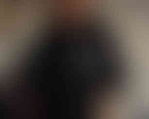 Black women's oversized T-shirt with front chest print of a women sitting in a meditative pose