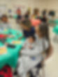 Families of The Transitions Program with their children at a Brethren Housing Association holiday party