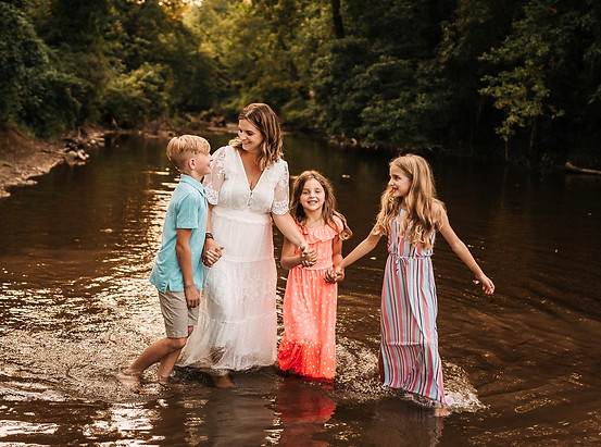 Megan Melchionni with her three children in a Central PA creek