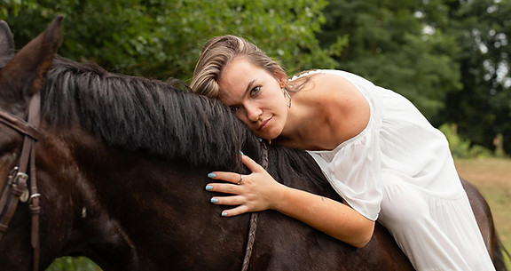 Senior on her horse during her senior portraits session