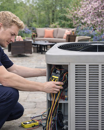 One of Daflure Heating Cooling and Solar's HVAC technicians at a Harrisburg, PA home testing the AC unit outside