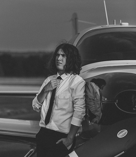 Senior portrait session at the Capital City Airport with a small plane