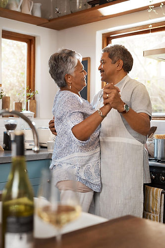 Sweet happy couple dancing in the kitchen after Daflure did AC maintenance at their Hummelstown PA home