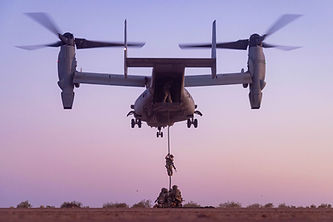 Soldiers dropping out of a helicopter