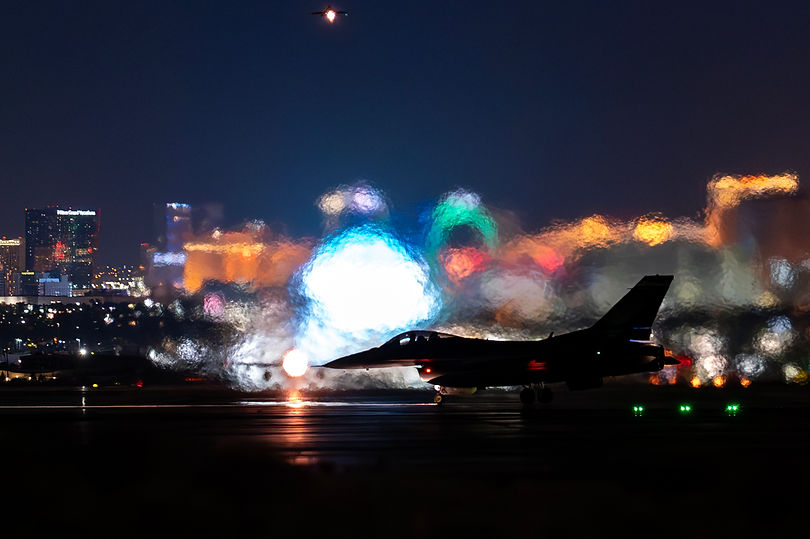A jet on the taxiway at night