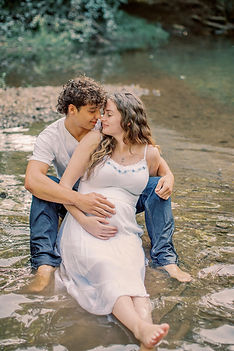 Young Couple maternity photo session in a Mechanicsburg, PA creek