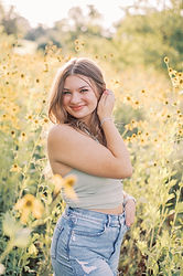 A beautiful senior portrait in a Mechanicsburg, PA field at Jessica Snider Photography's farm