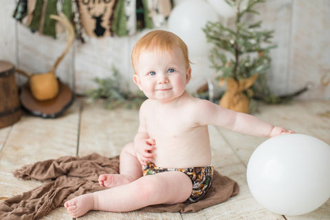 a rustic nature themed cake smash for a little red headed one year old boy at Jessica Snider Photography in Mechanicsburg, PA