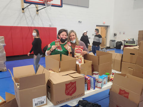 Brie Spangler and Leanna Via organizing and sorting donations